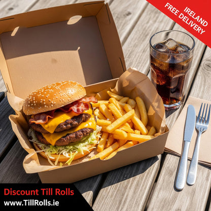 Hamburger and fries in a #12 Kraft Clamshell Menu Box (HP4) with a glass of soda on a wooden table, featuring 'Discount Till Rolls' branding.