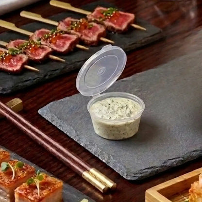 1oz Fusion Sauce Pots with Integrated Hinged Lid filled with sauce for dipping