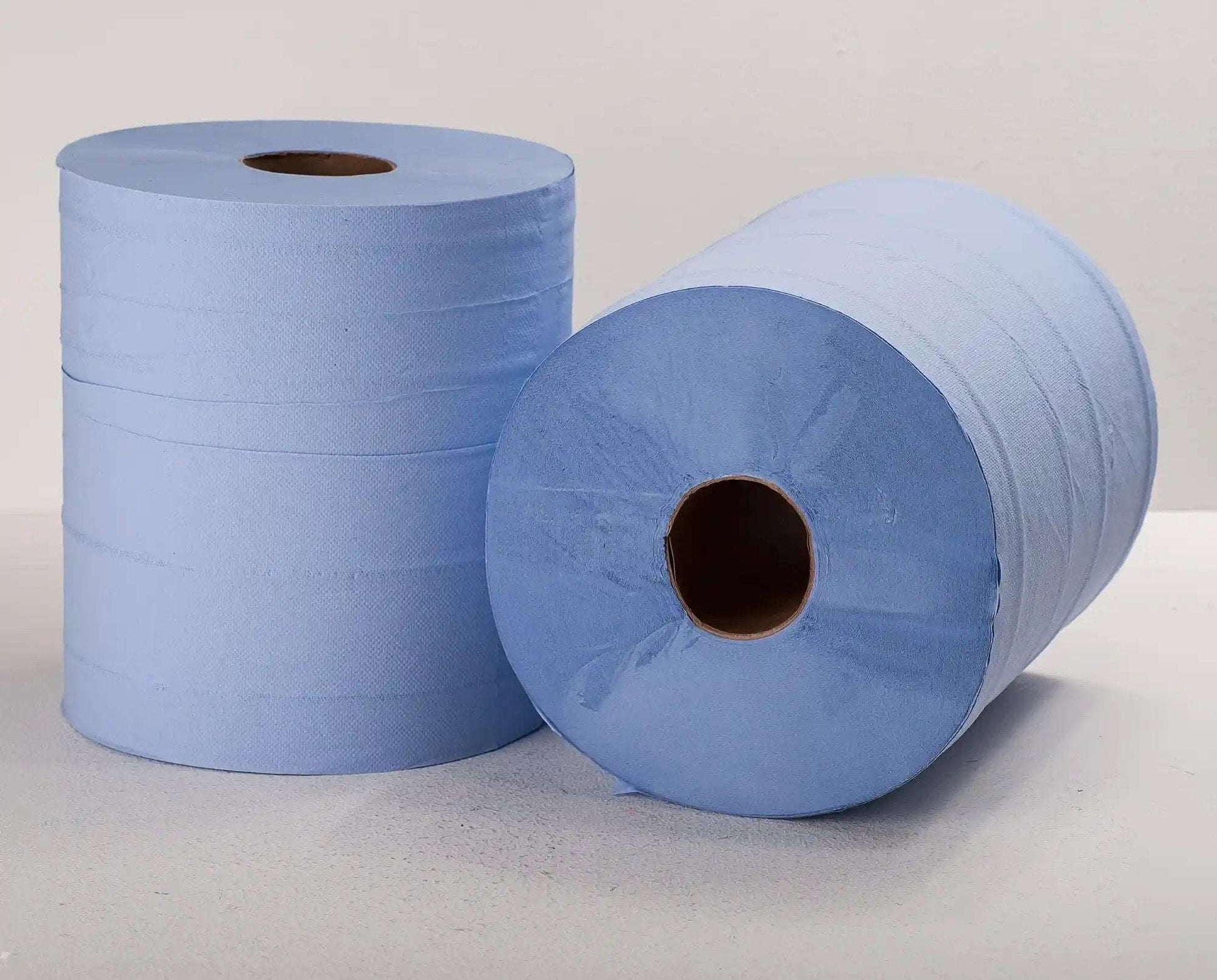 Two blue paper towels rolls on a light gray background