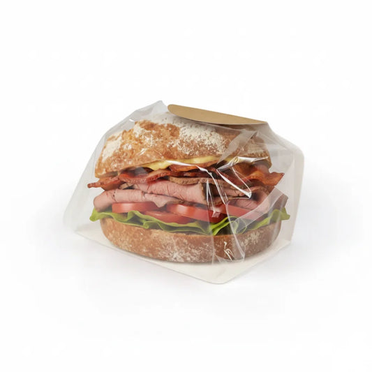 Deli sandwich with visible layers of bread, meat, and vegetables in a Hot Breakfast Bap with Film on a white background.