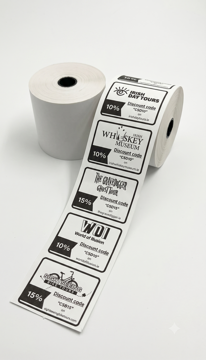A roll of printed discount voucher with several labels unspooled, shown on a clean white background. The labels feature black and gray text and logos for attractions such as Irish Day Tours, Whiskey Museum, The Whisker Goat Track, and WDI.