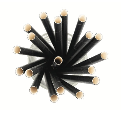 Black straws with beige tips arranged in a circular pattern on a white background