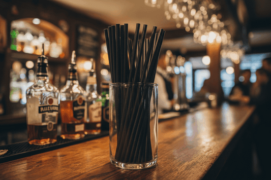 Black Compostable Paper Straws in glass container on pub bar counter