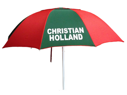 Red and green racecourse bookmakers umbrella with 'Christian Holland' text on a white background