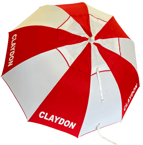 Red and white racecourse bookmakers umbrella with 'CLAYDON' branding on a white background