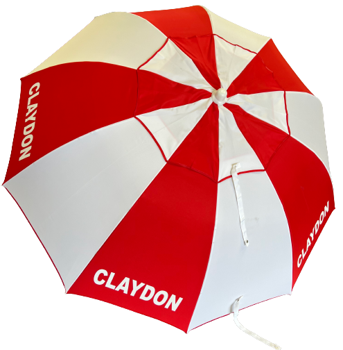 Red and white racecourse bookmakers umbrella with 'CLAYDON' branding on a white background
