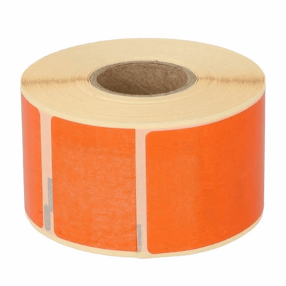 Roll of DYMO 99012 orange labels on a white background