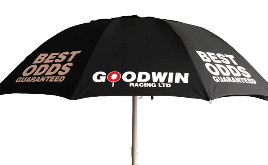 Black racecourse bookmaker umbrella with Goodwin Racing Ltd and Best Odds Guaranteed text on a brown background