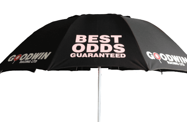 Black racecourse bookmaker umbrella with 'Best Odds Guaranteed' and 'Goodwin Racing Ltd' text on a white background