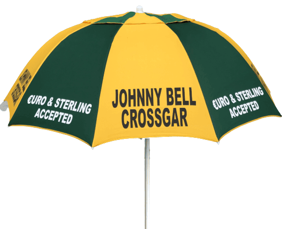 Green and yellow racecourse bookmaker umbrella with 'Johnny Bell Crossgar' branding on a white background