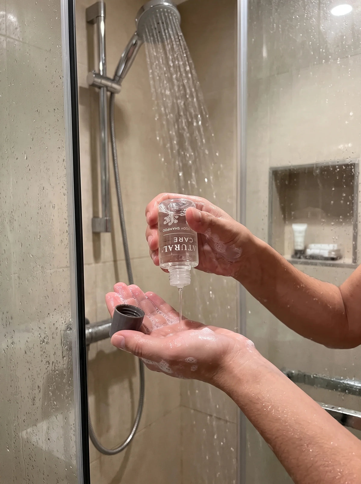 Natural Care Hair And Body Shampoo used in a shower