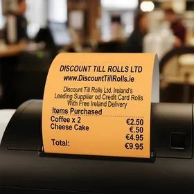 thermal printer printing an orange thermal receipt