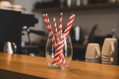 Red & White Compostable Paper Straws in cafe container