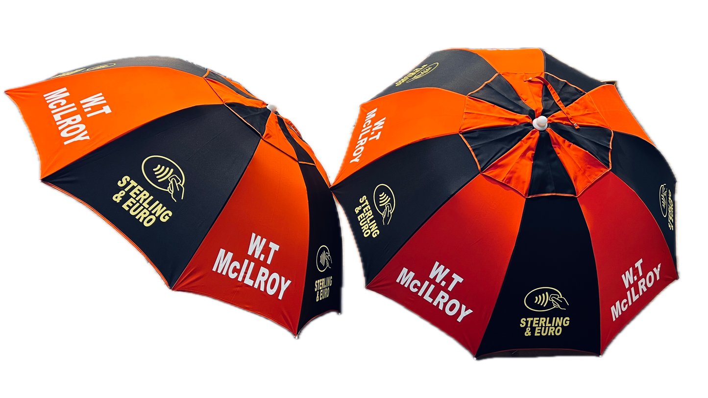 Two red and black umbrellas with branding W.T McIlroy on a white background